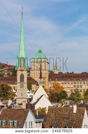Buildings Of The City Of Zurich, Switzerland, Tower Of The Predigerkirche Church In The Foreground.