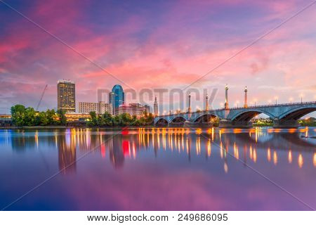 Springfield, Massachusetts, USA downtown skyline on the river at dusk.
