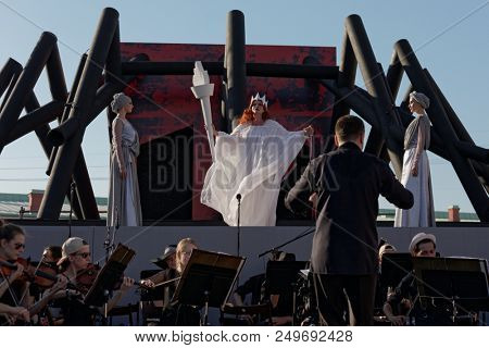 ST. PETERSBURG, RUSSIA - JULY 15, 2018: Julia Gertseva as Lady Macbeth (center) in the opera Macbeth outdoors during the festival All Together Opera. It was 2nd of 4 performances