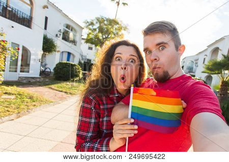 Amazing Homosexual Promote Their Relationship. Holding Gay Flag