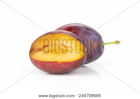 Group Of One Whole One Half Of Fresh Violet-blue Plum Vibrant Moyer Variety Isolated On White