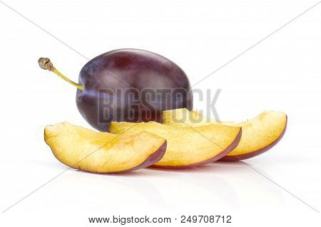 Group Of One Whole Three Slices Of Fresh Violet-blue Plum Vibrant Moyer Variety Isolated On White