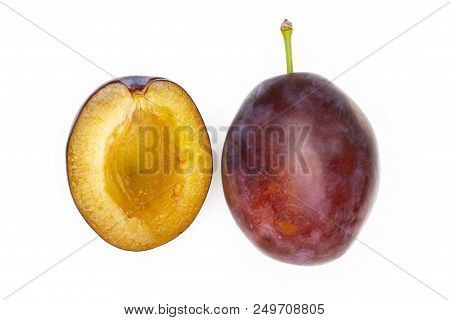 Group Of One Whole One Half Of Fresh Violet-blue Plum Vibrant Moyer Variety Flatlay Isolated On Whit