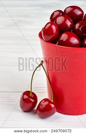 Bucket With Ripe Sweet Cherries. Healthy Summer Berries On White Background. Hervest Of Delicious Fr