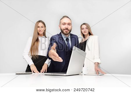 Employment, Contract. Three Business People, Man And Two Women On A White Background. Smiles And Con
