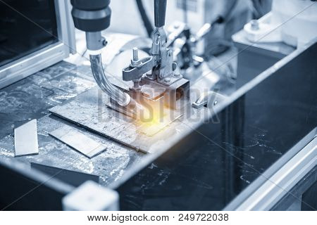The Welding Robot Machine For Welding Automotive Part In The Light Blue Scene.industrial 4.0 Concept