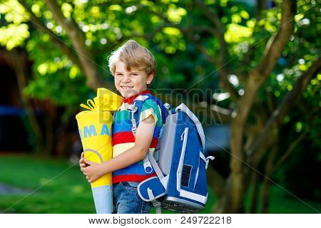Happy Little Kid Boy In Colorful Shirt And Backpack Or Satchel And Traditional German School Bag Con