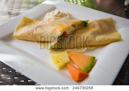 Crepe Stuffed With Eggs, Bacon, Spinach And Cheese
