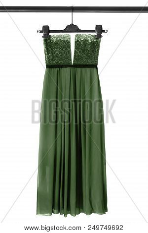 Elegant Green Chiffon Strapless Gown Hanging On Clothes Rack Isolated Over White
