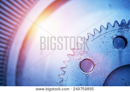 Old vintage rotor from an old power station in a close-up. Vintage machinery and engineering. Flare.