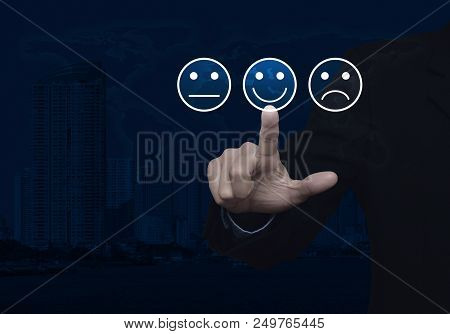Businessman Pressing Excellent Smiley Face Rating Icon Over World Map And Modern City Tower, Busines