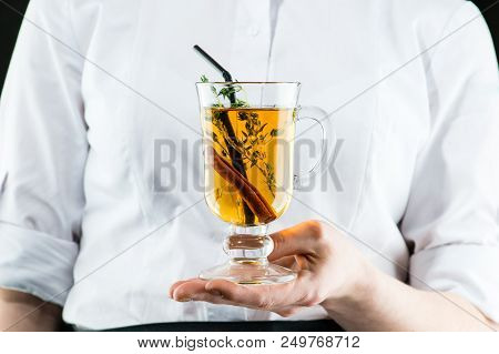 The Unidentified Waiter Brings A Hot Amaro Cocktail With Apple Juice And Cinnamon