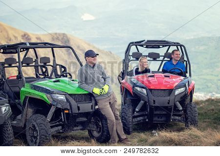 Friends Driving Off-road With Quad Bike Or Atv And Utv Vehicles.