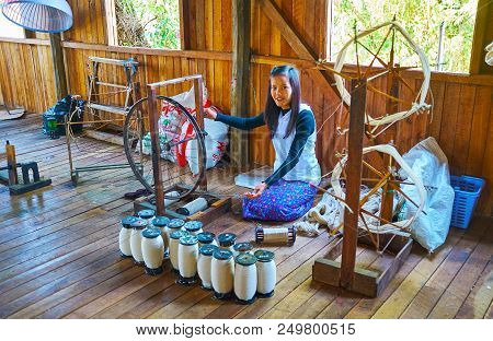 Inle Lake, Myanmar - February 18, 2018: The Burmese Artisan Spins The Lotus Yarn Onto The Spools In 