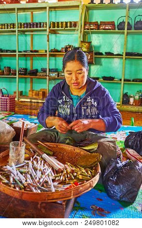 Ywama, Myanmar - February 18, 2018:  Burmese Woman Works In Cigarette Factory On Inle Lake, She Roll