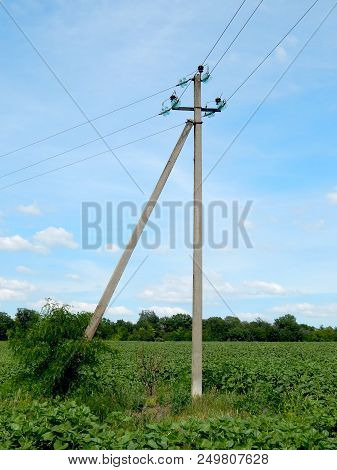 Electric Wires On A Support In A Blue Sky