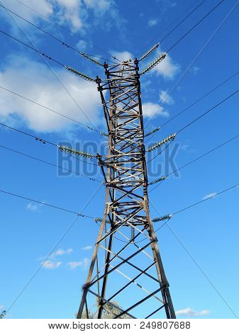 Electric Wires On A Support In A Blue Sky