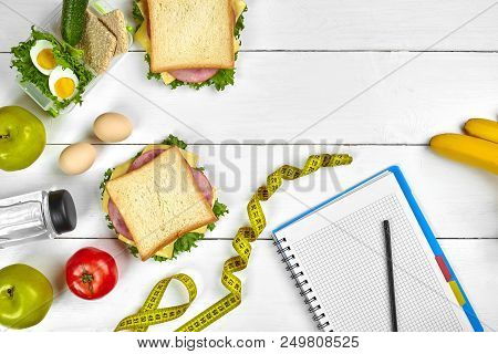 Top View Planning Notebook With Copy Space And Healthy Breakfast. Sandwich With Ham And Cheese, Eggs