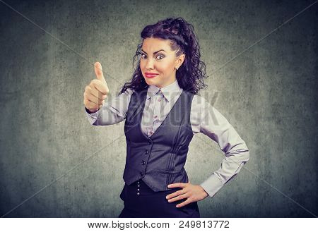 Young Business Woman Showing Thumbs Up Gesture Looking At Camera With Overconfidence