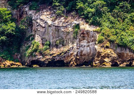 The Rocky Cliffs Of Sarushima, Or Monkey Island, Fall Away Into Tokyo Bay.