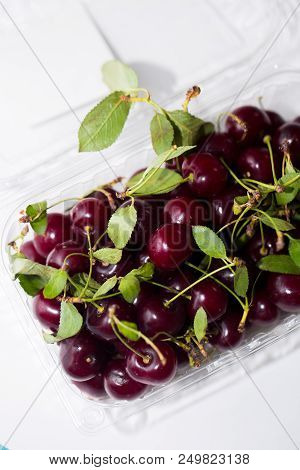Close-up Of Fresh Juicy Cherries On White Background, Top View