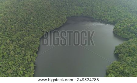 Aerial View Of Lake Bulusan In The Mountains With Green Rain Forest. Lake Hidden In The Jungle Mount