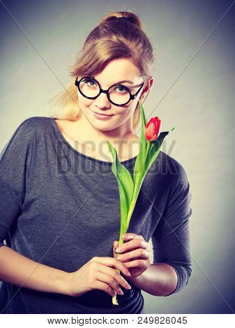 Delicacy And Subtlety Of Women. Young Adorable Woman With Spring Flower. Portrait Of Beauty Delicate