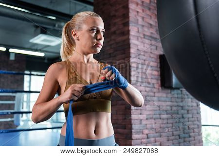 Appealing Trainer. Blue-eyed Appealing Fitness Wearing Stylish Comfortable Sport Clothes Trainer Get