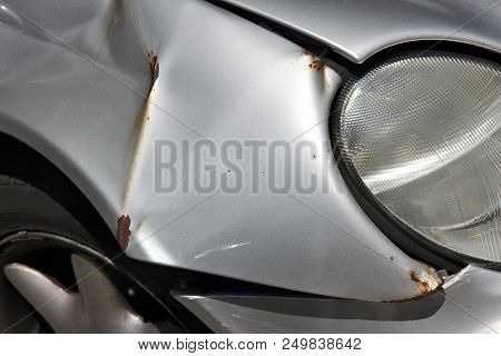 Generic Car With Unrepaired Accident Damage - Rust Overcoming Bent Steel.