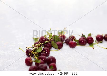 Ripe Cherry On A Light Gray Background, Selective Focus
