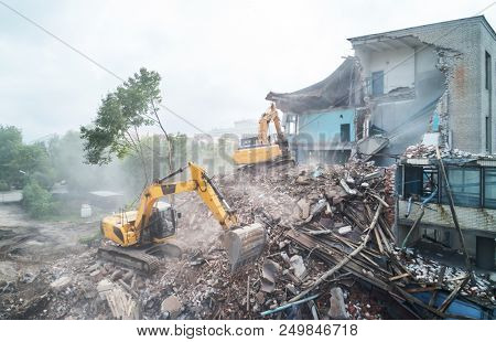 excavator crasher machine at demolition on construction site