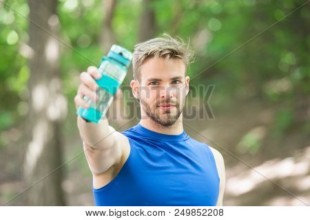 Towards A Healthier Lifestyle. Athlete Drink Water After Training In Park. Man Athletic Appearance H