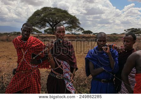 Unknown Village Near Amboselli Park, Kenya - April 02, 2015: Unknown Four Maasai Warriors In Traditi