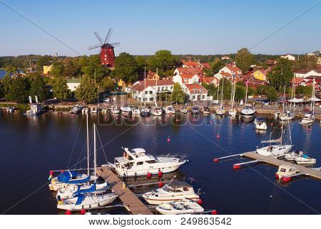 Strangnas, Sweden - July 16, 2018: Aerial View Of The Marina In The City Center With A Red Windmill 