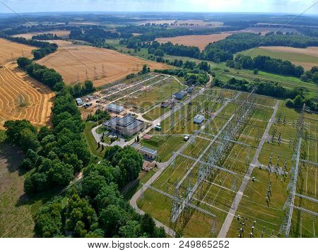 High Voltage Energy Transformer Station In Forest, Aerial View.