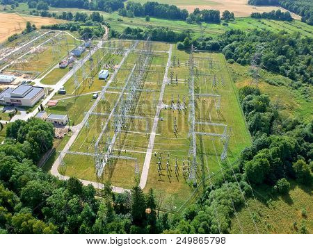 High Voltage Energy Transformer Station In Forest, Aerial View.