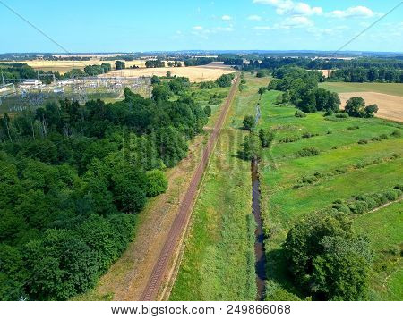 High Voltage Energy Transformer Station In Forest, Aerial View.