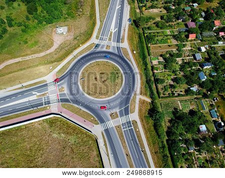 Roundabout Intersection In Three Directions With Island, Aerial View.