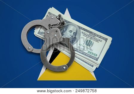 Saint Lucia Flag  With Handcuffs And A Bundle Of Dollars. Currency Corruption In The Country. Financ