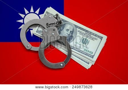 Taiwan Flag  With Handcuffs And A Bundle Of Dollars. Currency Corruption In The Country. Financial C