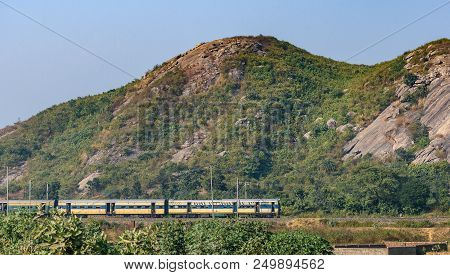 December 08,2016. Ranch,jharkhand, India.an Indian Passenger Train Is Passing By The Range Of Mounta