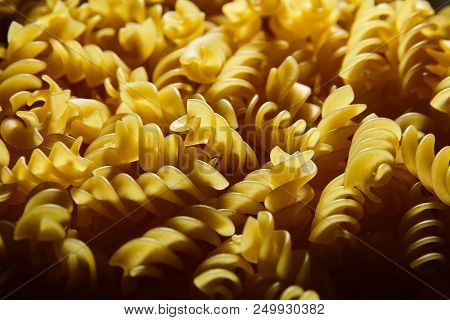 Raw Uncooked Dry Italian Fusilli Pasta. Corkscrew Spiral Shape