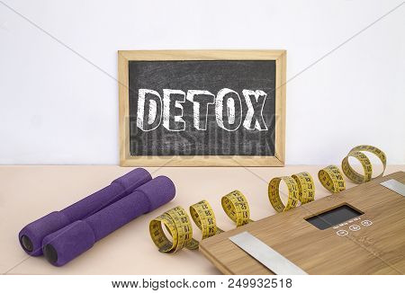 Blackboard With Message Detox, Weights, Tape And Scale