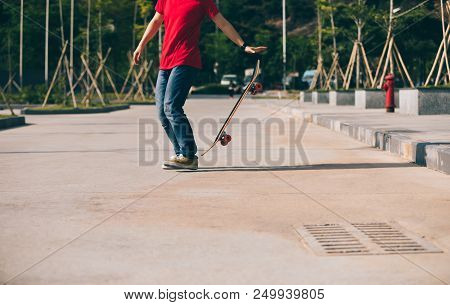 One Young Skateboarder Sakteboarding On Parking Lot