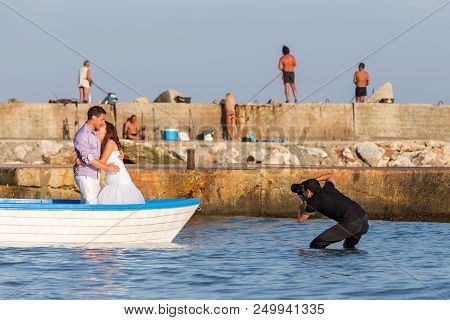Bolata Beach, Bulgaria - Aug 3, 2014: Wedding And Lifestyle  Photographer Shoots A Couple Of Affecti