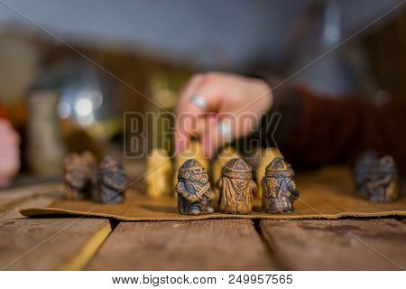 Close Up Shot - Two Men In Russian Ethnic Suit Playing Medieval Popular Strategy Board Game - Tafl. 