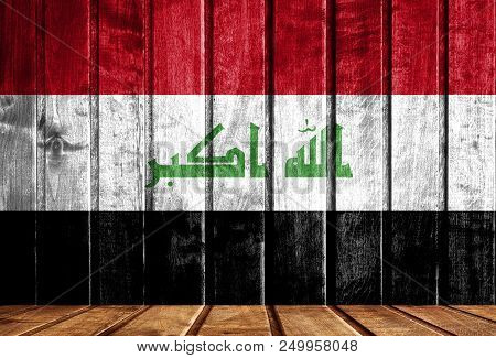Wooden Background With A Flag Of Iraq. There Is A Place For Your Text In The Photo.
