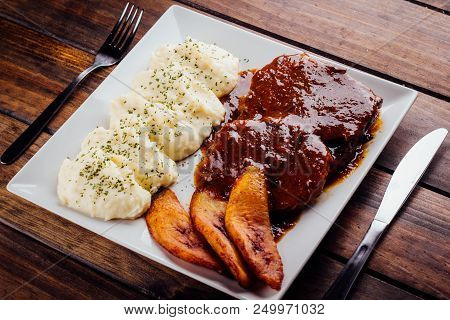 Asado Negro With Mashed Potatoes And Fried Plantain