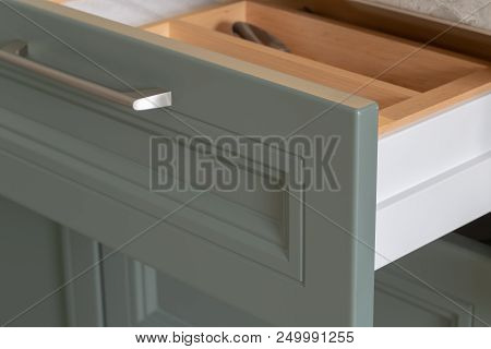 Shelf With Cutlery In The Kitchen With A New Design