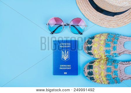 Travel Flatlay With Biometric Passport, Gradient Round Sunglasses, Straw Boater Hat And Espadrille S